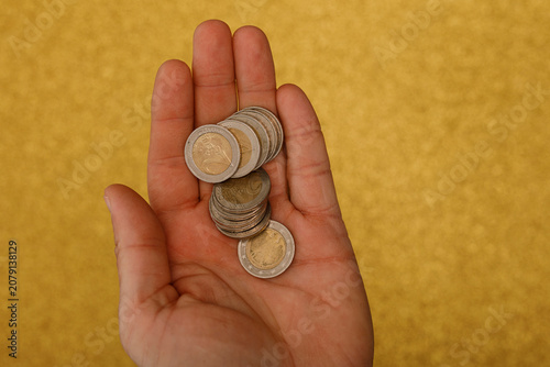 Person holding a pile of eu...
