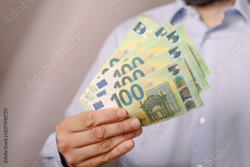 Close up of a man holding s...
