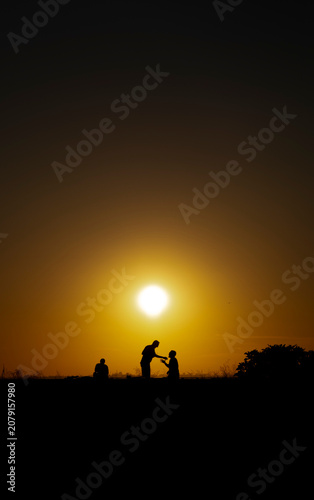 Panoramic view of people relaxing and talking during golden hour at dusk