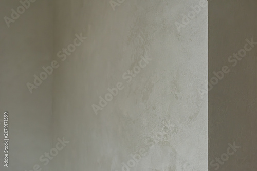 Fotografie Smooth plaster wall painted in light gray color Neutral decorative plaster wall