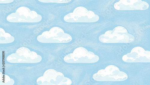 Soft blue sky with scattered, fluffy white clouds.