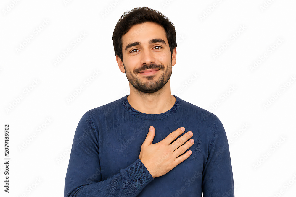 Fototapeta premium A smiling man in a blue sweater is posing against a white background, holding his hand over his chest.