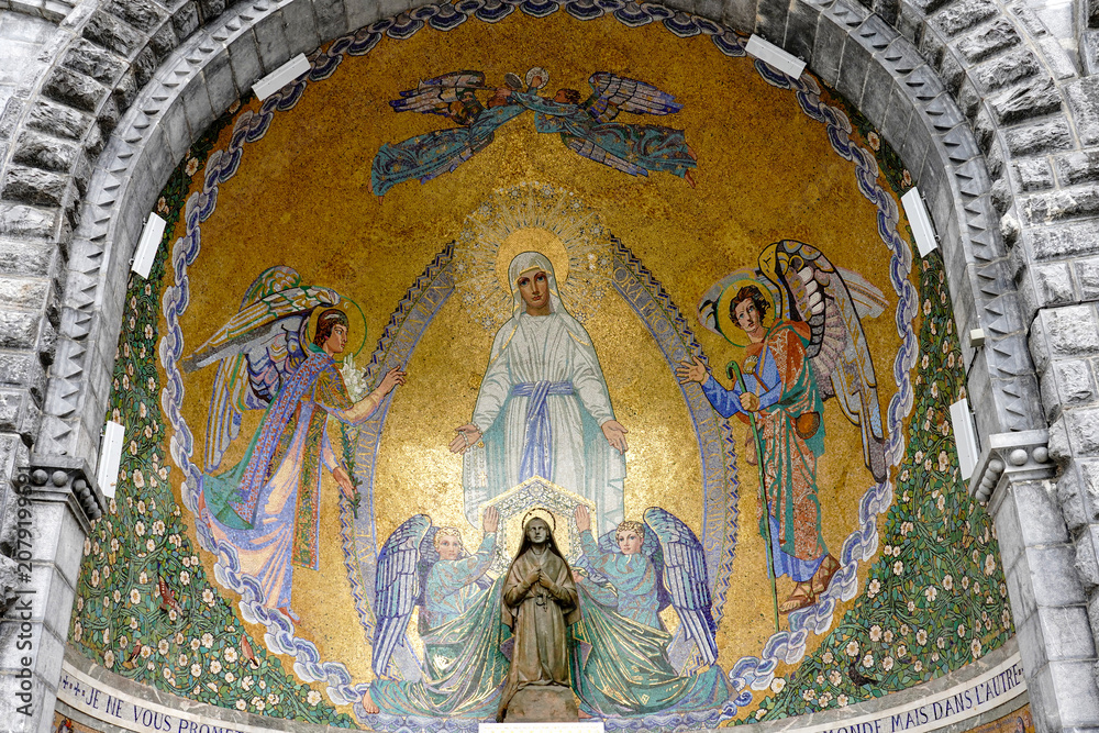 Naklejka premium France. Hautes-Pyrénées. Lourdes. A mosaic depicting the apparition of the Virgin Mary adorns the pediment of the Basilica of the Rosary