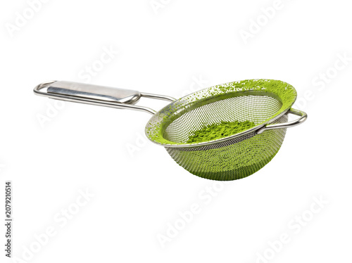 Stainless Steel Fine-Mesh Strainer with Green Matcha Powder Isolated on Black Background for Tea Preparation and Baking Recipes