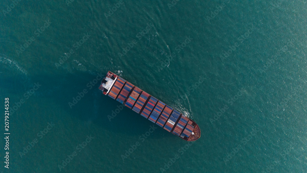 Fototapeta premium Aerial view from a container drone. Container ships in export-import and logistics business Transporting goods to large ports Worldwide shipping and logistics business International business abroad