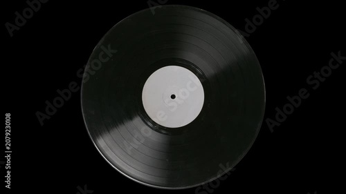 Retro style spinning vinyl record on black background