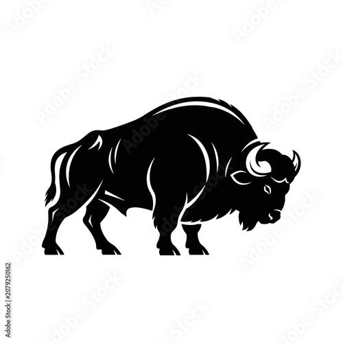 Powerful black buffalo or bison silhouette in a walking pose