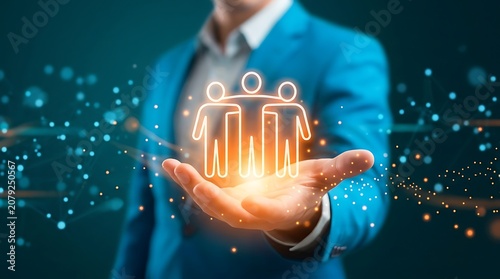 Business person holding a glowing team icon in hand