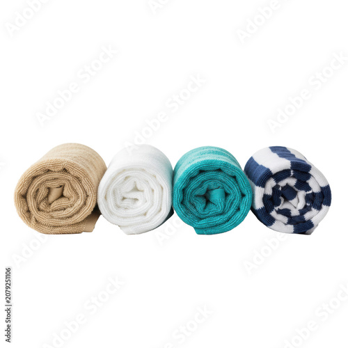 Four neatly rolled towels of varying textures: cream fluffy, white terry, turquoise plush, and striped cotton, on a smooth white surface, a premium commercial aesthetic