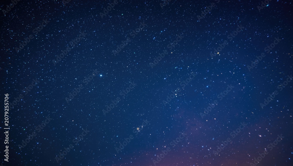 Fototapeta premium radiant blue and green stars glowing in night sky