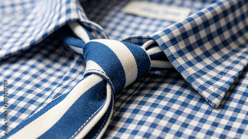 Close Up of Blue Striped Necktie on Blue Checkered Dress Shirt, Men's Business Fashion Concept