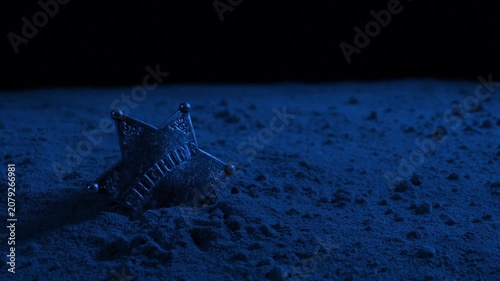 Sheriff Badge On The Ground At Night