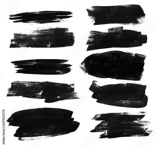 Set of black paint brush strokes with rich raster texture. Expressive ink marks and smudges for banners, highlights, and modern graphic compositions