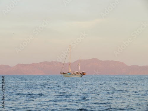 sailboat at sunset at sea in Baja California Sur, Mexico