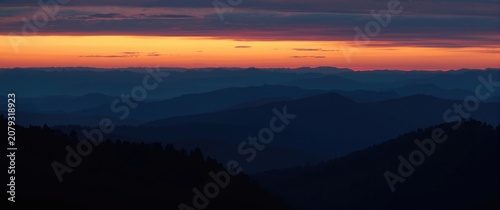 Mountain range silhouette a...