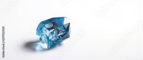 Blue crystal gem on a white...