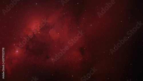 Deep red nebula with scatte...