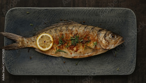 Grilled fish with lemon and...
