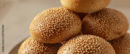 Sesame topped bread rolls s...