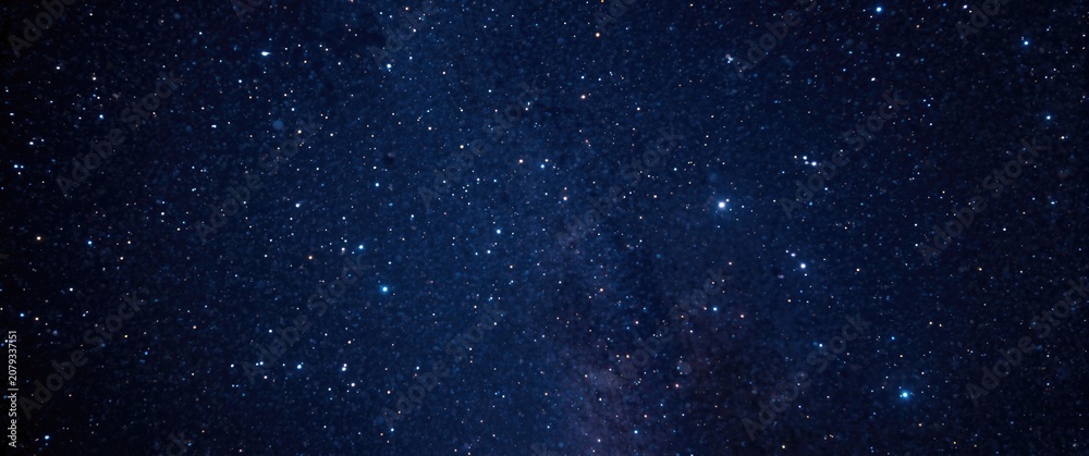 Fototapeta premium Night sky filled with stars and distant galaxies
