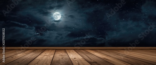 Moonlit night sky with clou...