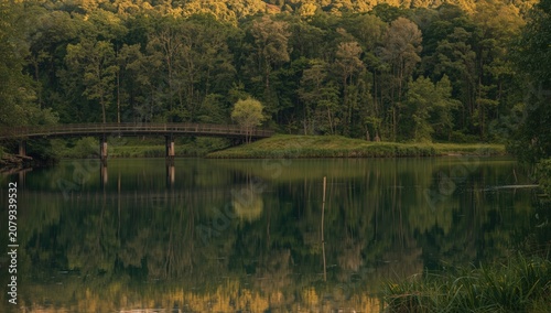 Wooden bridge over calm lak...