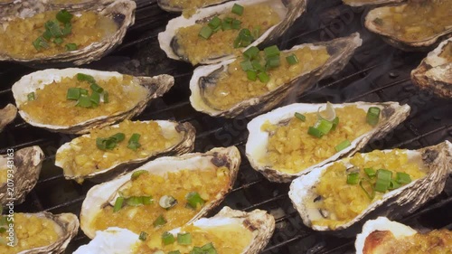 Grilled oysters at a night food market in a Chinatown