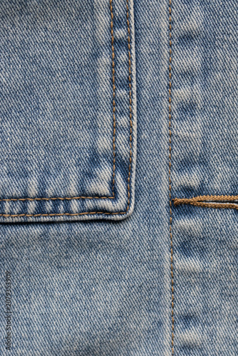 Fotografie Close-up of denim pocket corner and buttonhole