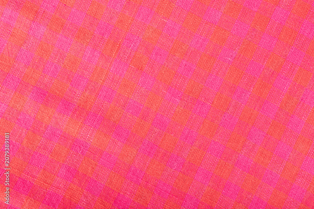 Fototapeta premium Pink and Orange Cotton Fabric Texture with Woven Check Pattern