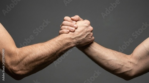 Hands Clasped In Mutual Strength