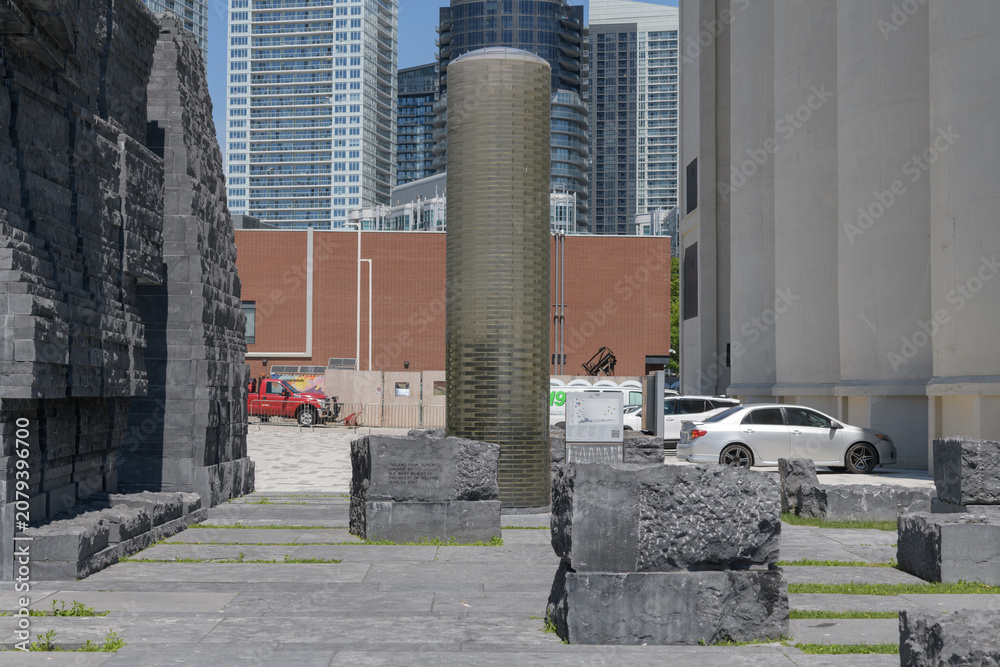 Obraz premium cylindrical column of stacked structural glass blocks, a beacon of hope, at Ireland Park, Toronto