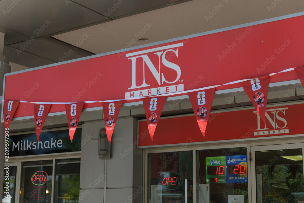 Obraz premium FIFA World Cup Coca-Cola bunting outside INS Market, a convenience store chain, located here at Waterclub Condominiums, Queens Quay W, Toronto
