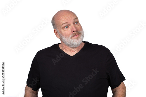 Bald Bearded Man Looking Sideways with Skeptical Amused Expression Isolated on White Background