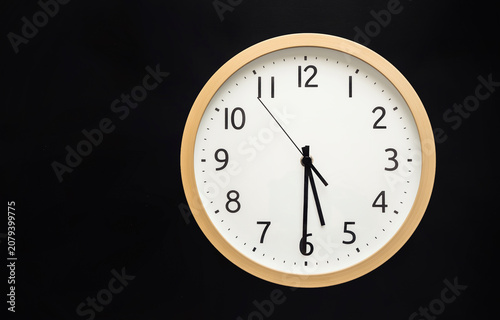 Wall clock showing five thirty . 5:30 . 17:30