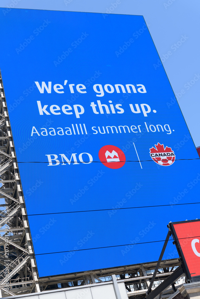 Obraz premium digital billboard advertisement for BMO, Bank of Montreal and sponsor of Soccer Canada at Sankofa Square, Toronto