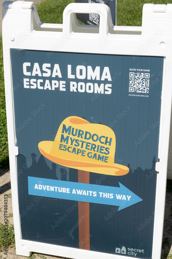 Obraz premium a-frame with poster outside Casa Loma Escape Rooms (Murdoch Mysteries Escape Game) at The Stable House, 330 Walmer Rd, Toronto