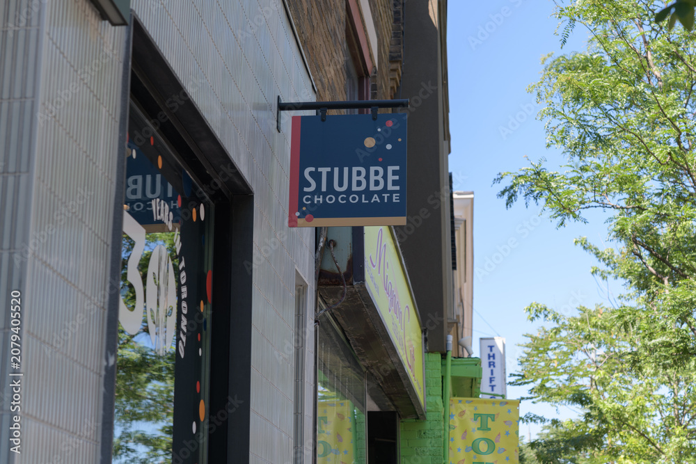 Obraz premium touch defocused exterior building facades and signage outside Stubbe Chocolate located at 653 St Clair Av W, Toronto