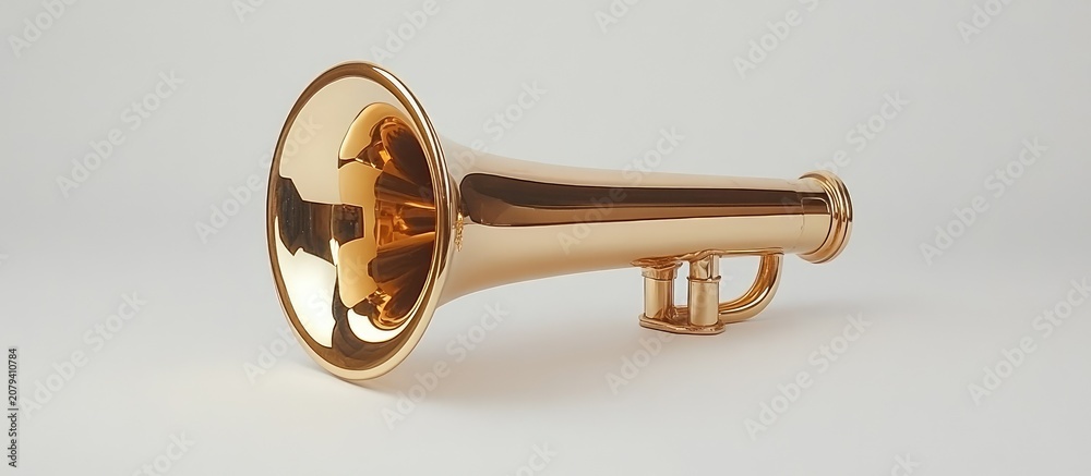 Obraz premium Golden brass trumpet musical instrument isolated on a light grey background for jazz and classical music themes