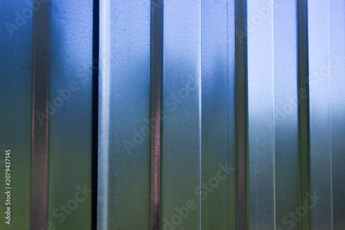 Corrugated metal profile. Wall, iron fence. Geometric aluminum panel. Iron plate, siding.