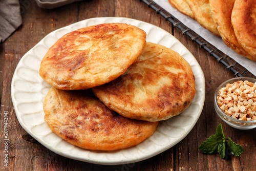 Korean street food hotteok made from sweet dough stuffed with various nuts, sugar and cinnamon.