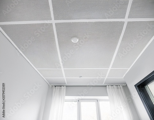 white ceiling tile with grid and textured surface creating clean and bright atmosphere in room