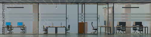 Modern Office Space: An empty, contemporary office interior featuring sleek desks, computers, and chairs visible through floor-to-ceiling windows.