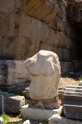 Photography bust statue in ruins of ancient city in rome