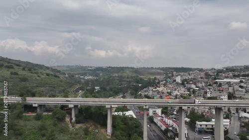 Aerial Panning Shot of Highway Bridge Traffic with Trailer Truck in Atizapán, Estado de México