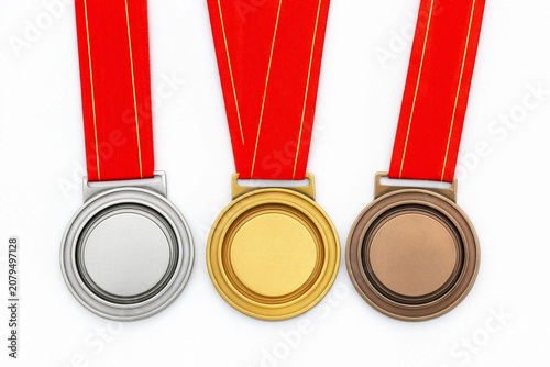 Gold, silver and bronze medals with red ribbons isolated on white background