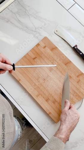 Sharpening a kitchen knife with a honing rod