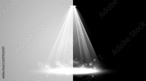 Bright white spotlight beam shining down on a split grey and black textured stage floor