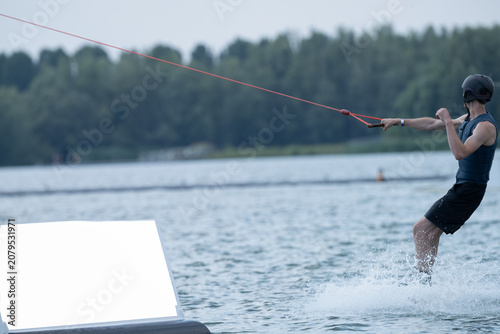 Man Wakeboarding On Hot Summer Day