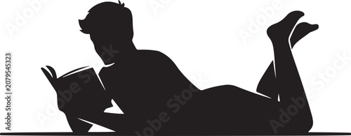 Foto Handsome guy reading a book while lying on the carpet