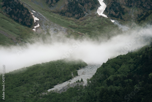 Fotografija Mountain fog forest valley river snow landscape green wilderness, misty mountain